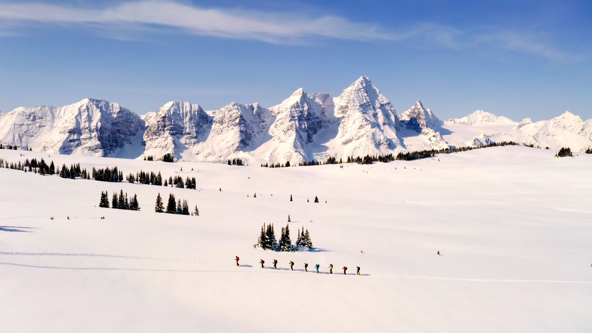 Aerial still of hikers on a ridge